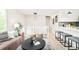 Spacious and open living area featuring modern furnishings and seamless kitchen access at 2988 S Hannibal St, Aurora, CO 80013
