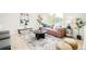 Bright living room with a large window and a comfortable seating area, perfect for relaxation at 2988 S Hannibal St, Aurora, CO 80013
