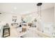 Inviting living room featuring modern decor, stylish lighting, and a staircase at 2988 S Hannibal St, Aurora, CO 80013