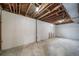 Unfinished basement area with exposed ceiling and concrete walls; awaiting customization at 7150 Beach St, Westminster, CO 80030
