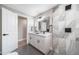 Bright bathroom with double vanity, updated fixtures, and walk-in shower at 7150 Beach St, Westminster, CO 80030