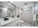 Updated bathroom featuring modern vanity, black fixtures, and sleek glass-enclosed shower at 7150 Beach St, Westminster, CO 80030