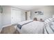 Cozy bedroom features a soft, inviting bed and closet with white doors at 7150 Beach St, Westminster, CO 80030