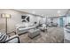 The open living room is bright and airy, showcasing neutral paint, recessed lighting, and contemporary finishes at 7150 Beach St, Westminster, CO 80030