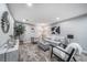 Stylish living room features plush carpeting, neutral paint and modern decor at 7150 Beach St, Westminster, CO 80030