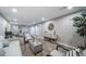 The large open living room boasts neutral paint, plush carpet, and recessed lighting at 7150 Beach St, Westminster, CO 80030