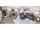 Spacious living room with wood floors, stylish furniture, and tasteful décor, perfect for entertaining at 7150 Beach St, Westminster, CO 80030