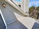 Balcony looking toward adjacent building, with rail and exterior wall light at 6731 S Ivy Way # B4, Centennial, CO 80112