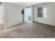 Spacious bedroom with neutral carpet, natural light, and an attached bathroom at 6731 S Ivy Way # B4, Centennial, CO 80112