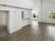 An open-concept layout with wood floors, high ceilings, a breakfast bar, and lots of windows for natural light at 6731 S Ivy Way # B4, Centennial, CO 80112