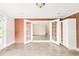 Large basement space featuring laminate wood floors, exposed brick, and access to the backyard at 6535 Balsam St, Arvada, CO 80004
