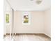 Cozy bedroom with updated floors, closet, and a window providing natural light at 6535 Balsam St, Arvada, CO 80004