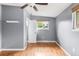 Well-lit bedroom with hardwood floors, and a large window with great natural light at 6535 Balsam St, Arvada, CO 80004