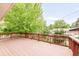 Large wooden deck offering scenic views and ample space for outdoor entertaining and relaxation at 6535 Balsam St, Arvada, CO 80004