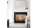 Fireplace creates an inviting atmosphere and is complemented by elegant decor, soft lighting, and hardwood floors at 6535 Balsam St, Arvada, CO 80004