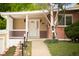 Inviting front entrance with a covered porch, decorative door, and well-maintained landscaping enhancing curb appeal at 6535 Balsam St, Arvada, CO 80004