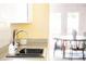 Bright kitchen sink area, featuring stainless steel fixtures and a backyard view at 6535 Balsam St, Arvada, CO 80004