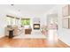 Bright living room features a cozy fireplace, modern decor, hardwood floors, and large windows that fill the space with natural light at 6535 Balsam St, Arvada, CO 80004
