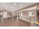 Bright finished basement with hardwood floors, recessed lighting, and an open floor plan at 20097 Royal Troon Dr, Monument, CO 80132