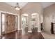 Inviting foyer with hardwood floors, high ceilings, and a decorative wooden door at 20097 Royal Troon Dr, Monument, CO 80132