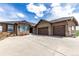 Spacious single-Gathering home with a three-car garage and a beautifully paved driveway at 20097 Royal Troon Dr, Monument, CO 80132