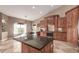 Spacious kitchen with a large island, wooden cabinets, and modern appliances at 20097 Royal Troon Dr, Monument, CO 80132