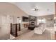 Cozy living room with a stone fireplace, plush furniture, and large windows for natural light at 20097 Royal Troon Dr, Monument, CO 80132