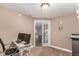 Functional office with dual monitors, neutral tones, and glass paneled doors for natural lighting at 20097 Royal Troon Dr, Monument, CO 80132