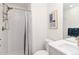 Bright bathroom featuring a subway tile shower, modern decor, and white vanity at 2409 Court Pl, Denver, CO 80205