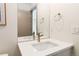 Modern bathroom showcasing a clean white vanity, neutral fixtures, and ample counter space at 2409 Court Pl, Denver, CO 80205