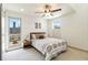 Bright bedroom features patterned bedding, wood accents, and city views at 2409 Court Pl, Denver, CO 80205