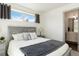 Comfortable bedroom featuring a queen bed, gray wood headboard and neutral color palette at 2409 Court Pl, Denver, CO 80205