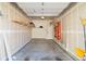 Spacious two car garage with concrete floor, shelving, and ample storage at 2409 Court Pl, Denver, CO 80205