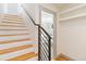 Hallway with view into bedroom with plush bed and plenty of natural light at 2409 Court Pl, Denver, CO 80205