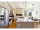Modern kitchen features stainless appliances, gas range, a large island, and wood floors at 2409 Court Pl, Denver, CO 80205