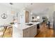 Modern kitchen with a center island, stainless steel appliances, and hardwood floors at 2409 Court Pl, Denver, CO 80205