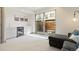 Relaxing living room with wet bar, beverage cooler and sliding glass door to backyard patio at 2409 Court Pl, Denver, CO 80205