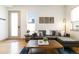Comfortable living room featuring a modern couch, decorative accents, and hardwood floors at 2409 Court Pl, Denver, CO 80205