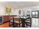 Elegant dining area with a wine fridge and seamless transition to the living room at 6115 W Mansfield Ave # 242, Denver, CO 80235