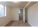 Neutral colored basement room with carpet and natural light from the window at 1945 Nome St, Aurora, CO 80010