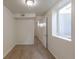 A carpeted basement room with a window provides ample space and natural light at 1945 Nome St, Aurora, CO 80010