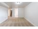 A carpeted basement room leads to a staircase, offering versatile use and accessibility at 1945 Nome St, Aurora, CO 80010