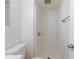 Bright bathroom showcases a shower with built-in shelves, a clean toilet, and neutral walls at 1945 Nome St, Aurora, CO 80010
