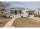 Charming gray single-story home with a well-maintained front yard and inviting entryway at 1945 Nome St, Aurora, CO 80010
