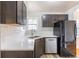 Updated kitchen features stainless appliances, modern countertops, and neutral finishes at 1945 Nome St, Aurora, CO 80010