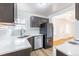 Renovated kitchen features stainless appliances, modern countertops, and ample lighting at 1945 Nome St, Aurora, CO 80010