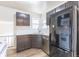 Updated kitchen features stainless appliances, modern cabinets, and bright countertops at 1945 Nome St, Aurora, CO 80010