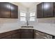 Bright kitchen features stainless appliances, subway tile backsplash, and modern countertops at 1945 Nome St, Aurora, CO 80010
