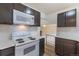 Updated kitchen features subway tile, and stainless appliances at 1945 Nome St, Aurora, CO 80010