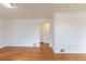 Bright living room featuring hardwood floors and white walls, ready for new décor and personalization at 1945 Nome St, Aurora, CO 80010
